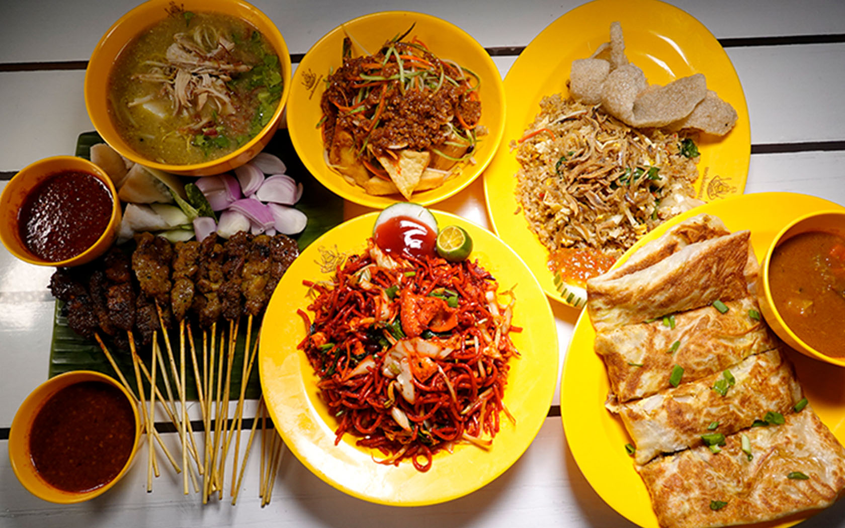Image of BBQ chicken wings, fried carrot cake, fried kway teow, oyster cake and fried prawn noodle