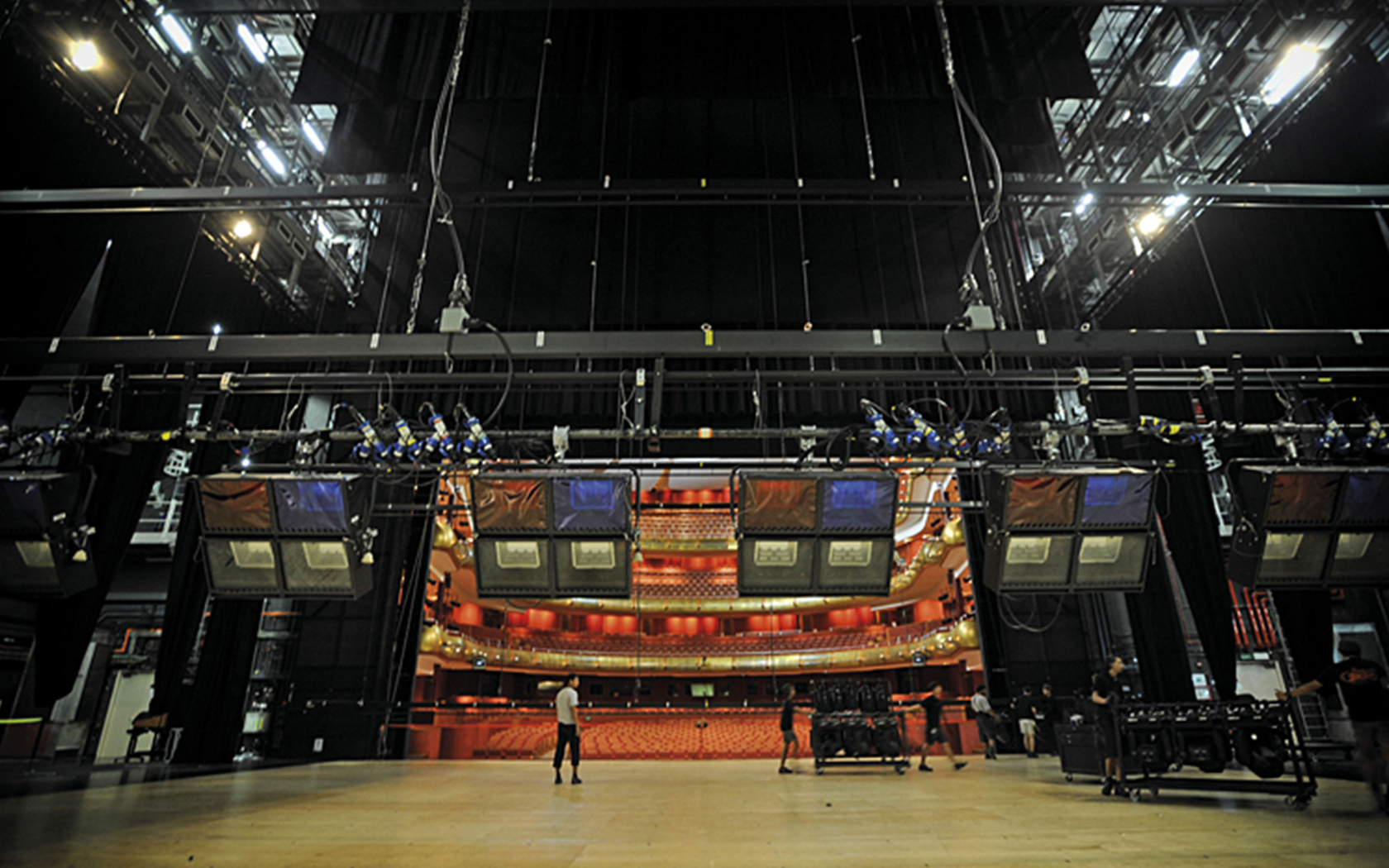 An image of people moving stage equipments on Esplanade Theatre stage