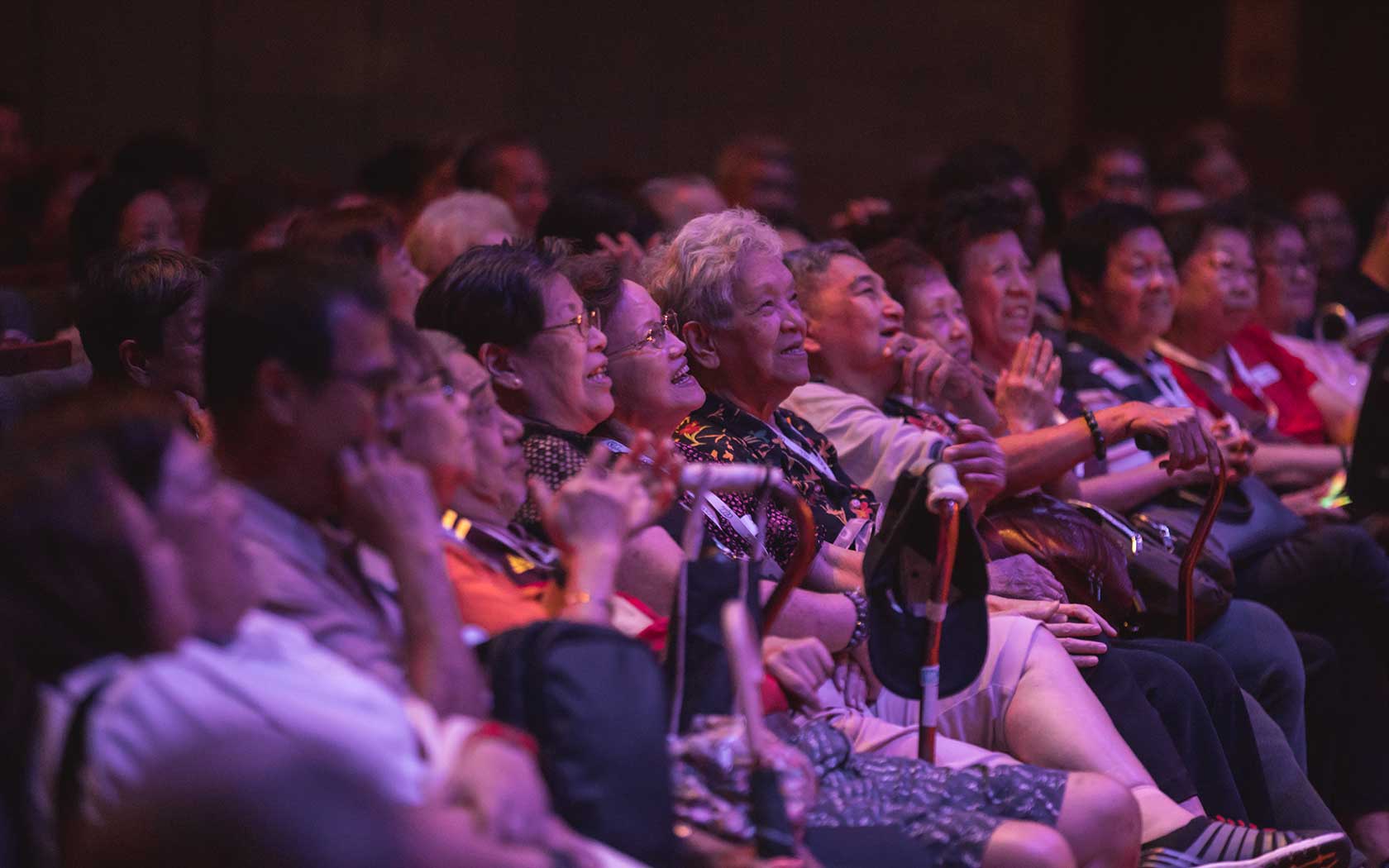 Image of seniors in the audience watching a performance at Esplanade.