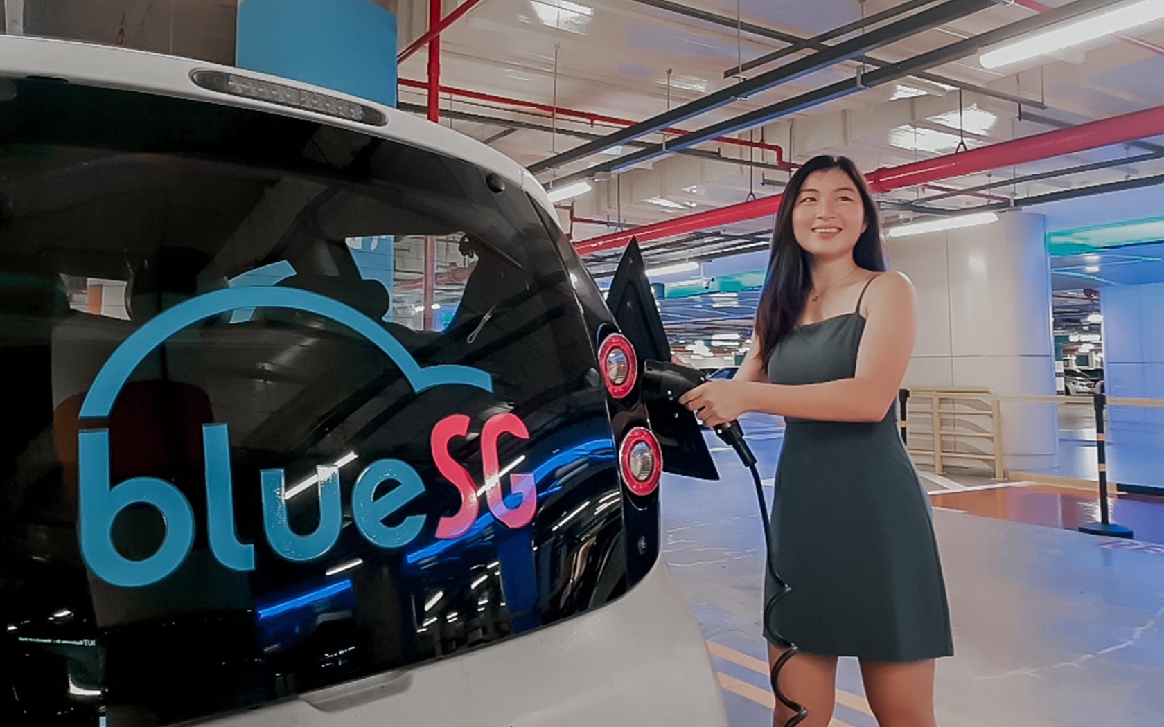 Image of lady charging a BlueSG Car
