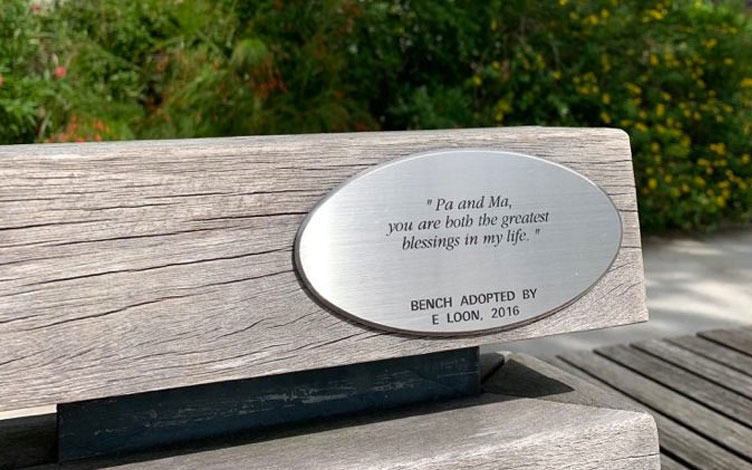 A donor’s plaque on a bench