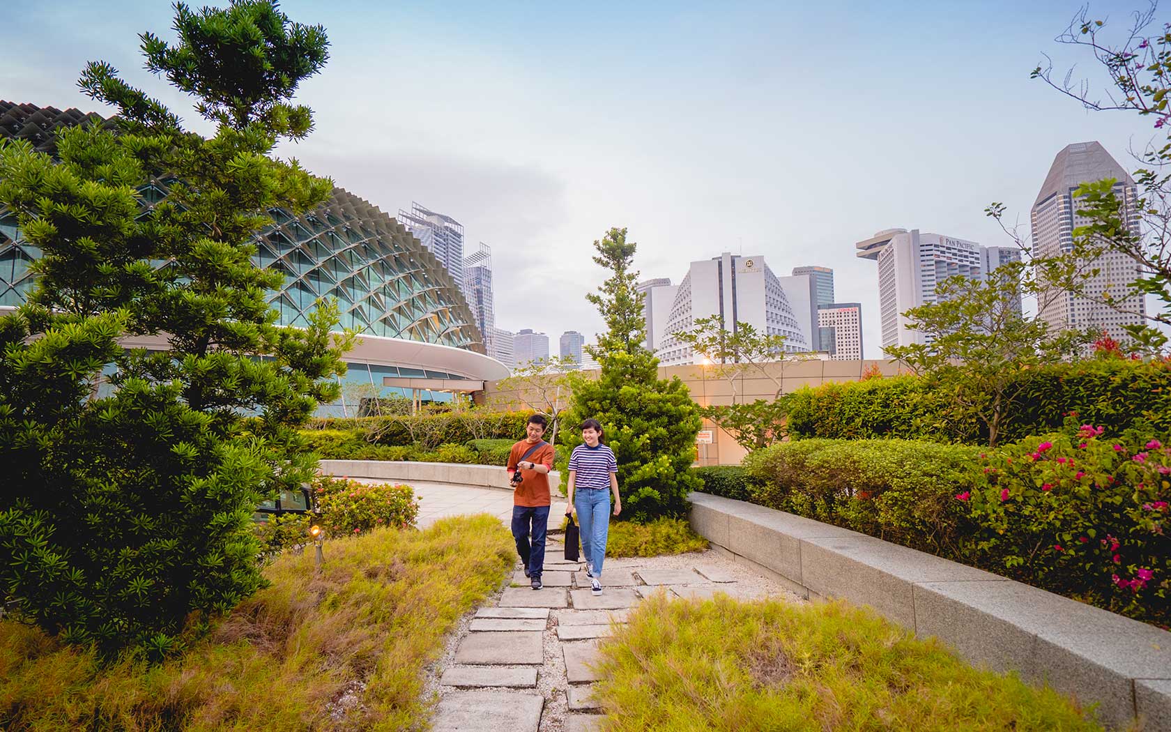 Image of two people walking at the Roof Terrace at Esplanade