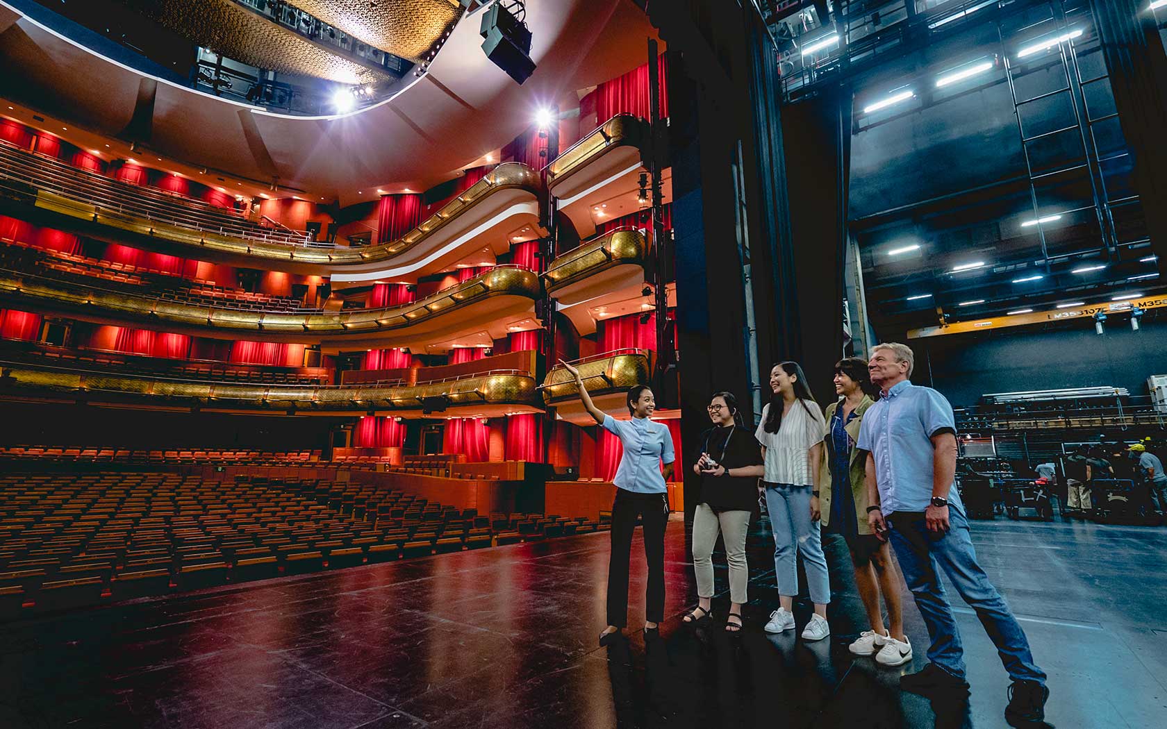 Image of participants on the Esplanade Theatre stage during a guided tour.