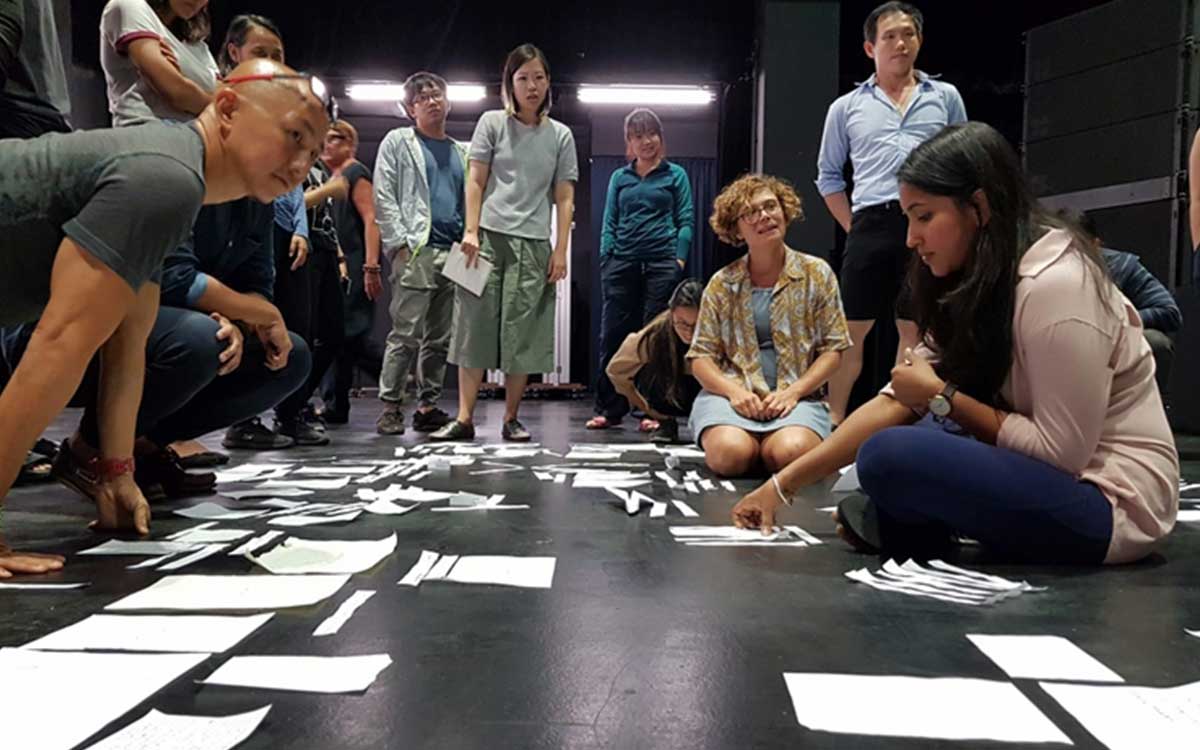 Image of a group of arts practitioners in discussion.