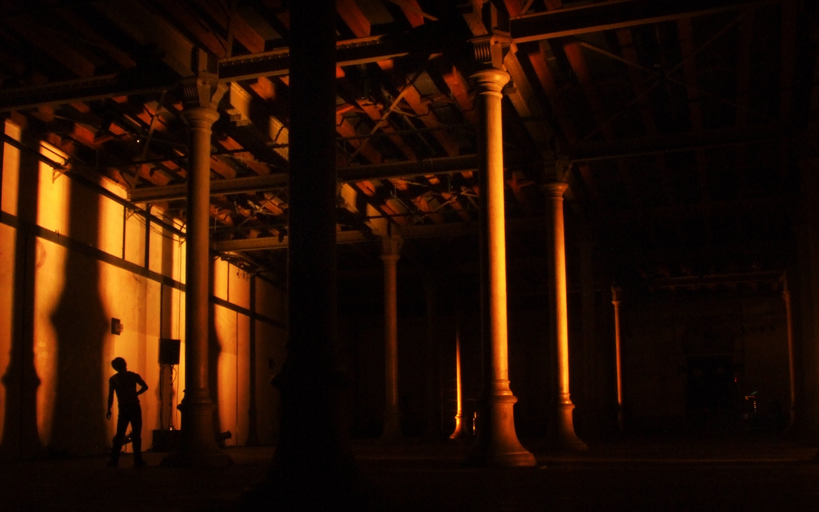 An image of light being casted on stage pillars