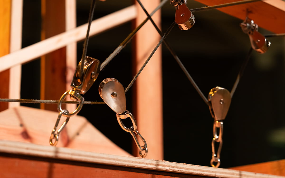 A close-up of a series of pulleys and ropes used in Breath of the Land《呼吸之地》, Lim Soo Ngee and Yang Jie, 2025.