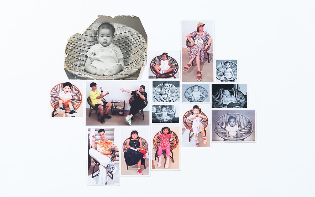 A wall collage featuring photographs of people from all walks of life seated on a circular rattan chair.
